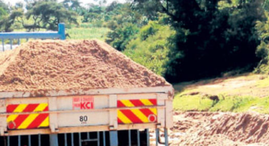 File image of a lorry being loaded with sand.